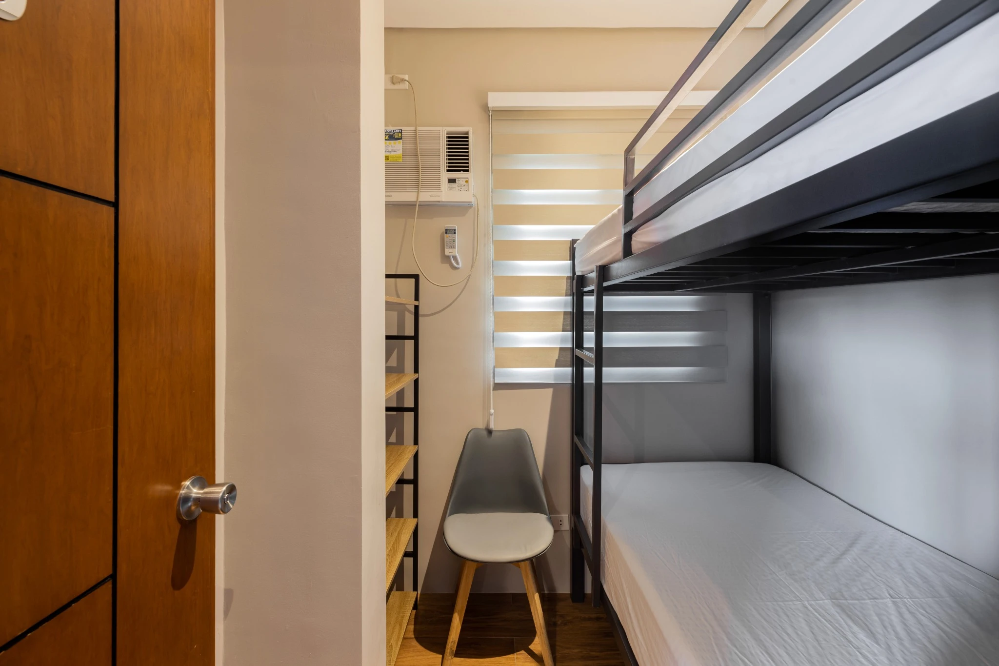Pod room with bunk bed and shelf